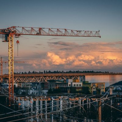 A beautiful view of a construction site in a city during sunset